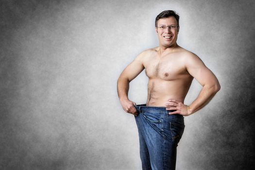 Image of a man in blue jeans who has lost body weight