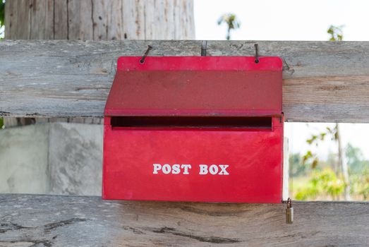 Old Red Metal Postbox in Countryside.