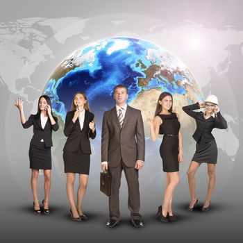 Business women and men in suits, smiling and looking at camera. Against the background of globe and world map. Elements of this image furnished by NASA