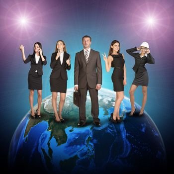 Business women and men in suits, smiling and looking at camera. Against the background of globe and glowing spotlight. Elements of this image furnished by NASA