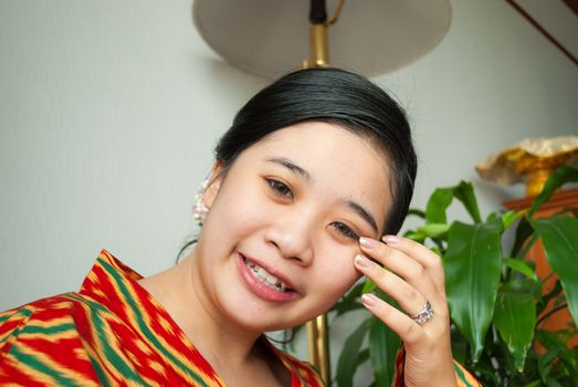 Asian Thai Girl with Beautiful Hair Style and Wedding Ring.