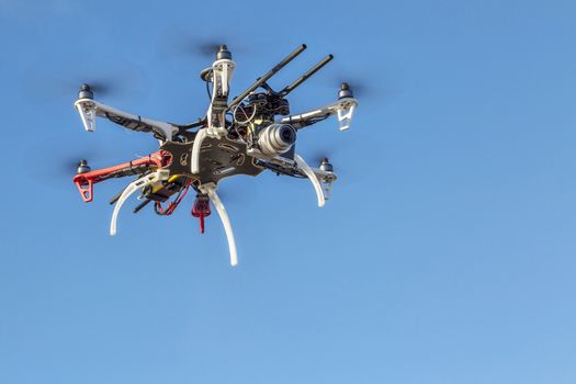 FORT COLLINS, CO, USA, December 2,  2014:  DJI  F550 Flame Wheel  hexacopter drone, assembled from a kit, flying with a small prosumer camera.