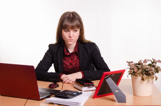 Cute business woman in the office at the compute