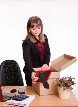 Woman fired or hired in the office and collect or parses personal belongings out of the box