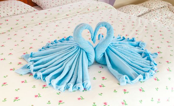 Couple of Blue Swans in Heart Shaped Towel.