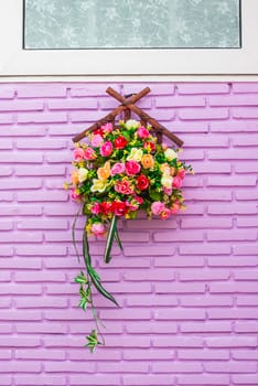 Roses on Purple Brick Wall.