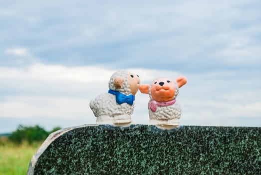 Sheep Figures on Marble Wall.