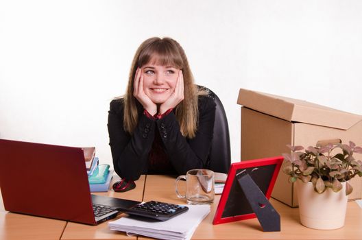 Cute business woman in the office at the computer