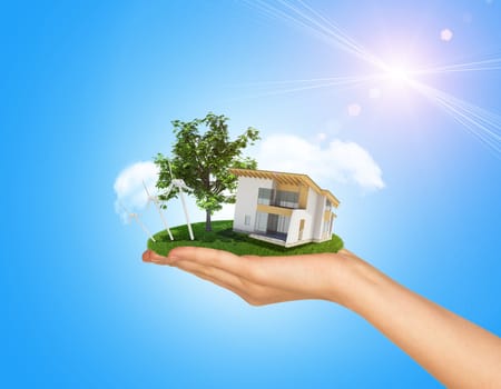 White cottage in hand with green roof. Background sun shines brightly on right. Blue sky