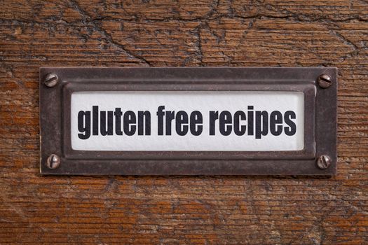gluten free recipes - file cabinet label, bronze holder against grunge and scratched wood