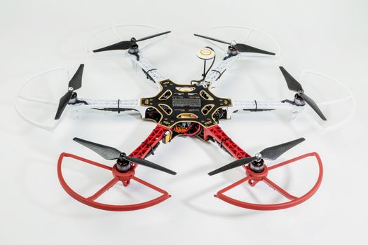 FORT COLLINS, CO, USA, December 13,  2014:  Radio controlled DJI  F550 Flame Wheel  hexacopter drone with propeller guards  on a white background. This drone is assembled from  a kit,