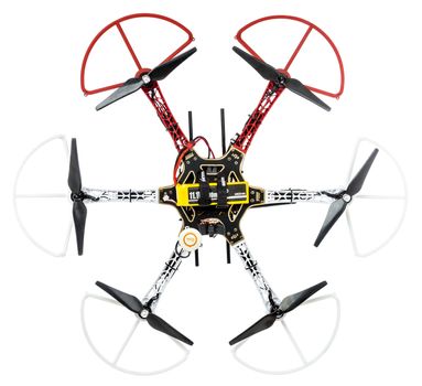 FORT COLLINS, CO, USA, January 14,  2015:  Radio controlled DJI  F550 Flame Wheel  hexacopter drone with carbon fiber propellers and LiPo battery. top view isolated on white.