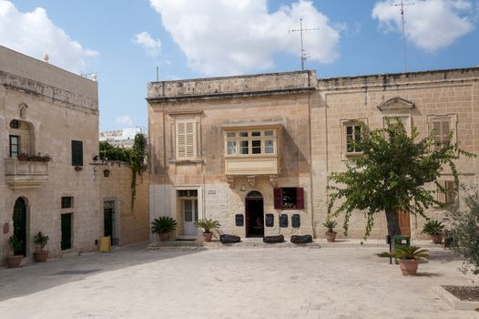 town square with old buildings in victoria village or rabat on the malta island gozo