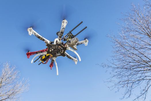 FORT COLLINS, CO, USA, December 2,  2014:  DJI  F550 Flame Wheel  hexacopter drone, assembled from a kit, flying with a prosumer camera.