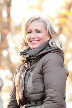 Portrait of a blond woman in autumn