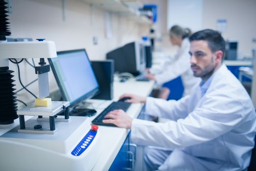 Food scientist using technology to analyse cheese at the university