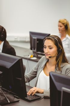 Call centre agents talking on the headset in the office