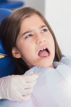 Portrait of a young patient in dental examination in clinic