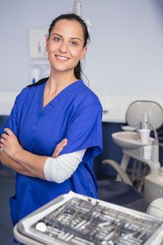 Portrait of a happy dentist with arms crossed