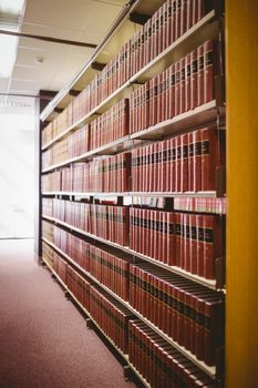 Close up of shelf with old books in library