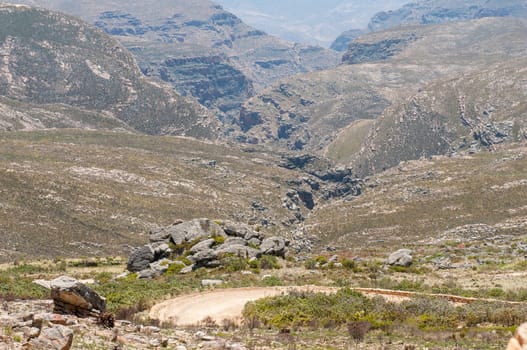 Inhospitable valleys of the arid Swartberg (Black Mountain) as seen from the top of the pass. The pass is a declared national