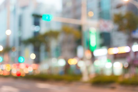 Abstract urban background with blurred buildings and street, shallow depth of focus.