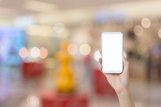 Using smartphone in a market or department store, closeup image.