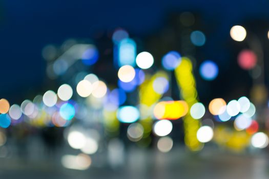 Abstract urban background with blurred buildings and street, shallow depth of focus.