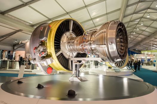 Farnborough, UK - July 12, 2012: Exhibition stands displaying large jet engines and other components used in the aviation industry at the Farnborough International Airshow, UK