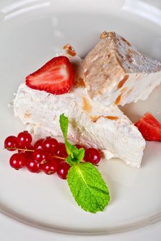 cream dessert with berries cranberries and strawberry