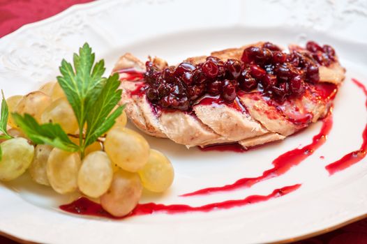 chicken breast meat with cranberry sauce