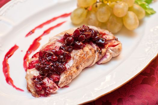 chicken breast meat with cranberry sauce