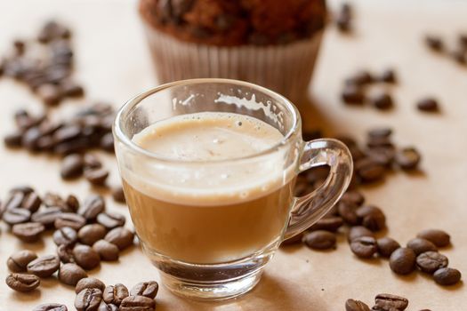Cup of latte coffee with a biscotti
