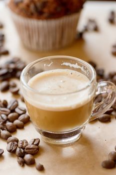 Cup of latte coffee with a biscotti