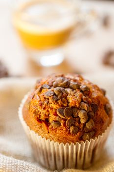 Chocolate a muffin near the coffee latte