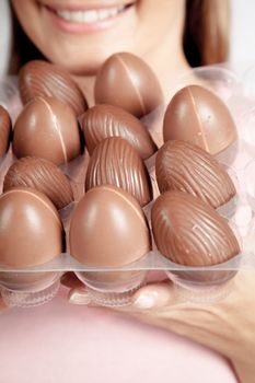 20-25, background, caucasian, decoration, easter, egg, event, felicity, female, giving, hand, handmade, happy, holding, hope, human, life, model, old, one, palm, people, person, portrait, property, releases, seasonal, show, showing, smile, smiling, studio, symbol, traditional, white, woman, years, young