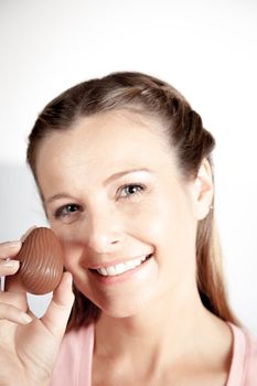 20-25, background, caucasian, decoration, easter, egg, event, felicity, female, giving, hand, handmade, happy, holding, hope, human, life, model, old, one, palm, people, person, portrait, property, releases, seasonal, show, showing, smile, smiling, studio, symbol, traditional, white, woman, years, young