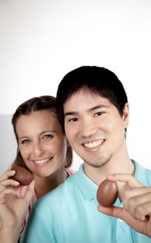 20-25, asian, background, caucasian, Couple, covering, decoration, easter, egg, event, felicity, female, giving, hand, handmade, happy, holding, hope, human, life, love, man, model, old, one, palm, people, person, portrait, property, releases, seasonal, show, showing, smile, smiling, studio, surprise, symbol, together, traditional, white, woman, years, young