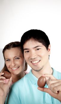 20-25, asian, background, caucasian, Couple, covering, decoration, easter, egg, event, felicity, female, giving, hand, handmade, happy, holding, hope, human, life, love, man, model, old, one, palm, people, person, portrait, property, releases, seasonal, show, showing, smile, smiling, studio, surprise, symbol, together, traditional, white, woman, years, young