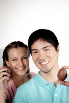 20-25, asian, background, caucasian, Couple, covering, decoration, easter, egg, event, felicity, female, giving, hand, handmade, happy, holding, hope, human, life, love, man, model, old, one, palm, people, person, portrait, property, releases, seasonal, show, showing, smile, smiling, studio, surprise, symbol, together, traditional, white, woman, years, young