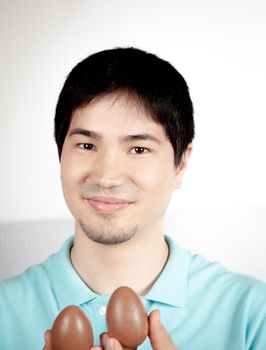 20-25, asian, background, caucasian, decoration, easter, egg, event, felicity, giving, hand, handmade, happy, holding, hope, human, life, male, man, model, old, one, palm, people, person, portrait, property, releases, seasonal, show, showing, smile, smiling, studio, symbol, traditional, white, years, young