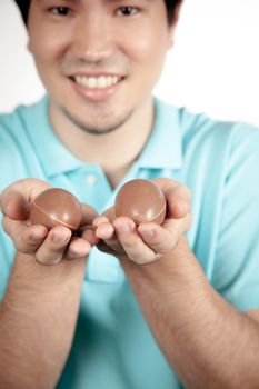 20-25, asian, background, caucasian, decoration, easter, egg, event, felicity, giving, hand, handmade, happy, holding, hope, human, life, male, man, model, old, one, palm, people, person, portrait, property, releases, seasonal, show, showing, smile, smiling, studio, symbol, traditional, white, years, young
