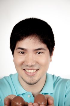 20-25, asian, background, caucasian, decoration, easter, egg, event, felicity, giving, hand, handmade, happy, holding, hope, human, life, male, man, model, old, one, palm, people, person, portrait, property, releases, seasonal, show, showing, smile, smiling, studio, symbol, traditional, white, years, young