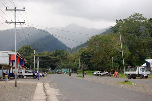 People at Alotau town street, hills view, Papua New Guinea