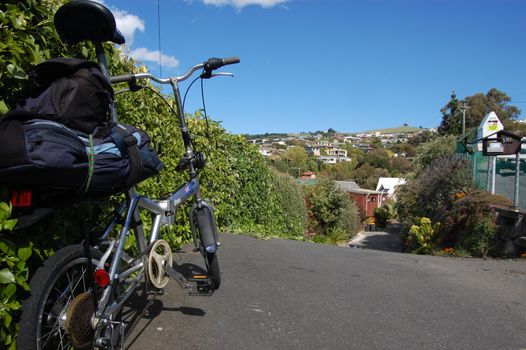 Folding bycicle at town roadside, Christchurch, New Zealand