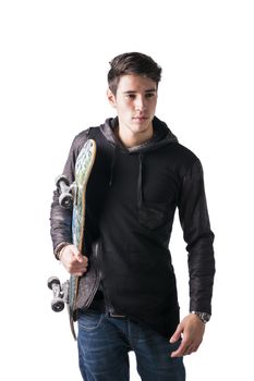 Handsome trendy young man with skateboard under his arm, isolated on white