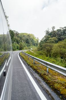 Travel by van in forest on road up to Doi Inthanon mountain Chiang Mai, Thailand