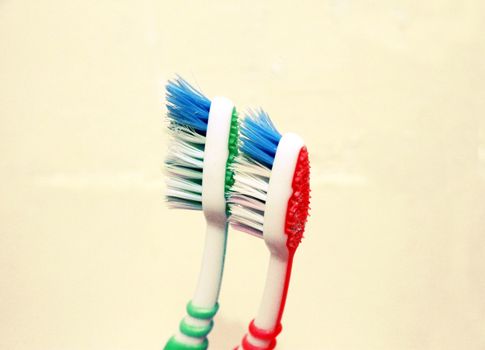 Green and red tooth brushes isolated on the white background