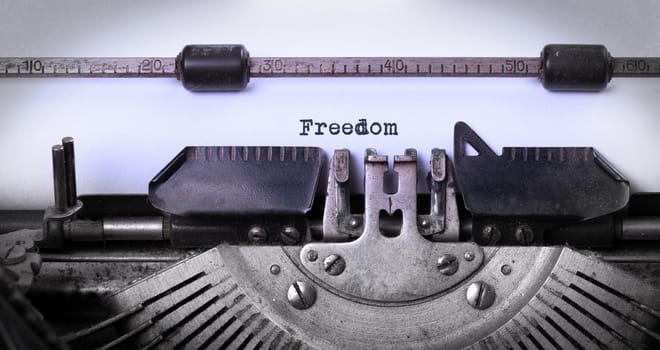 Vintage inscription made by old typewriter, freedom