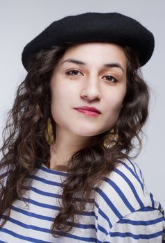 Portrait of a Young Woman with Barrett Hat and Striped T-shirt